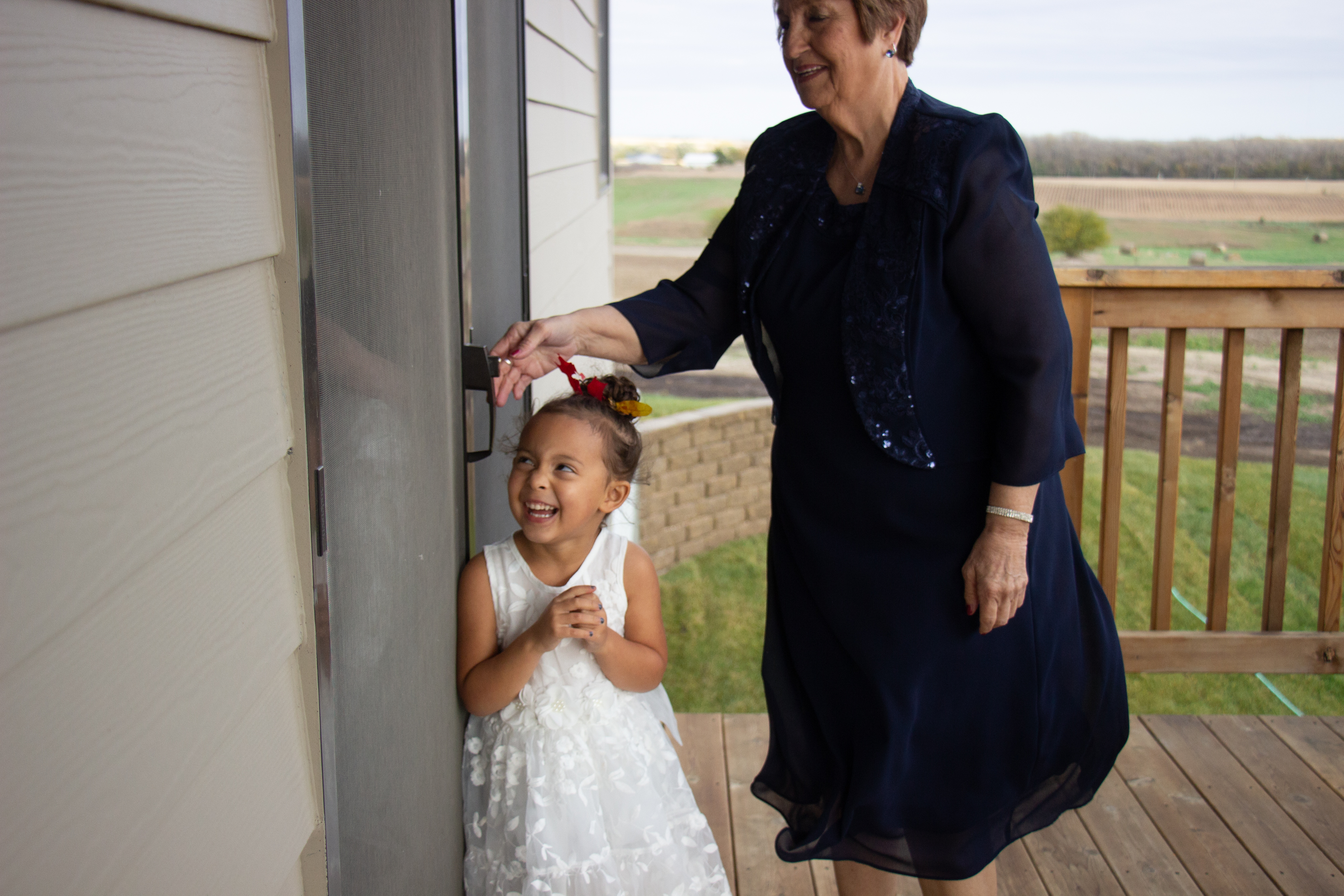 Flower girl enjoys a laugh with the bride